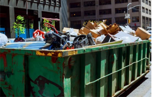 dumpster filled with junk rubbish