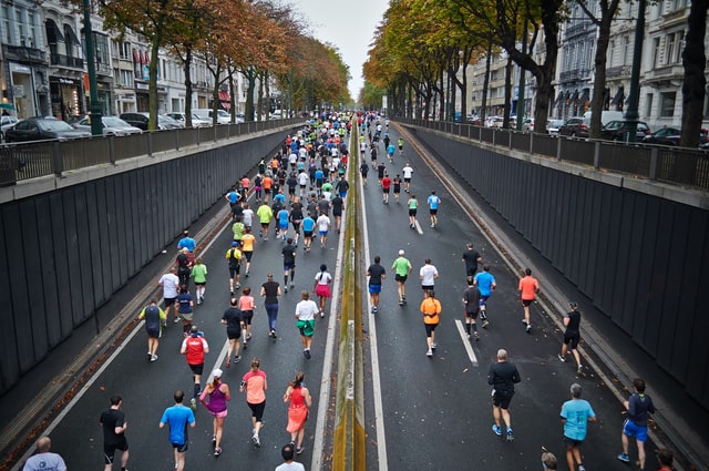 marathon runners running on the street