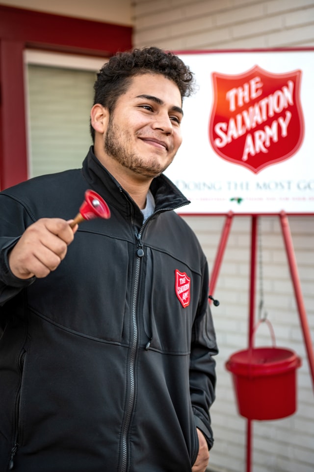 salvation army volunteer ringing a bell